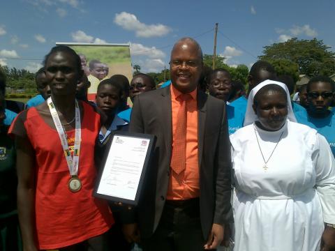 UK Sport's Elias Musangeya (centre) with Sister Winifred (right)